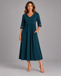 Clara | Vestido midi evasé com mangas a três quartos, azul-petróleo