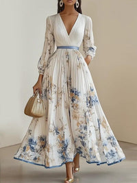Vestido Maxi Línea A de Gasa Blanca Plisada con Mangas Largas Abullonadas y Escote en V con Estampado Floral